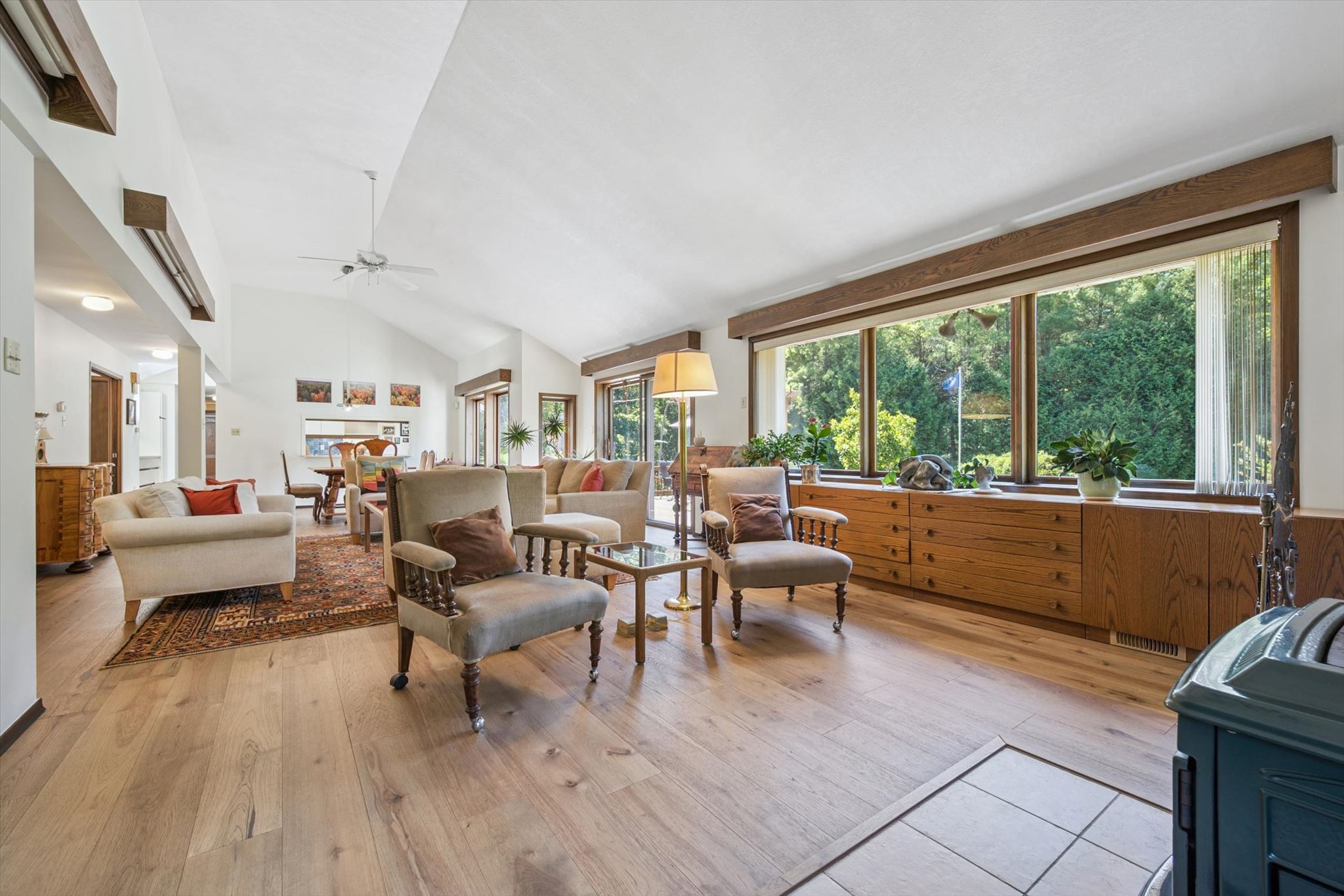 The 40-foot living and dining room, with picture windows to the forest