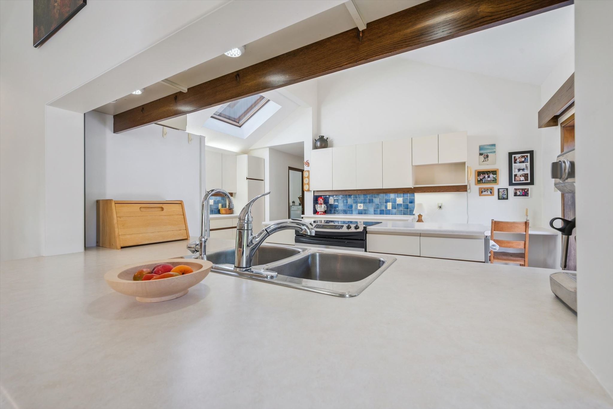 Kitchen pass-through, lit by a skylight