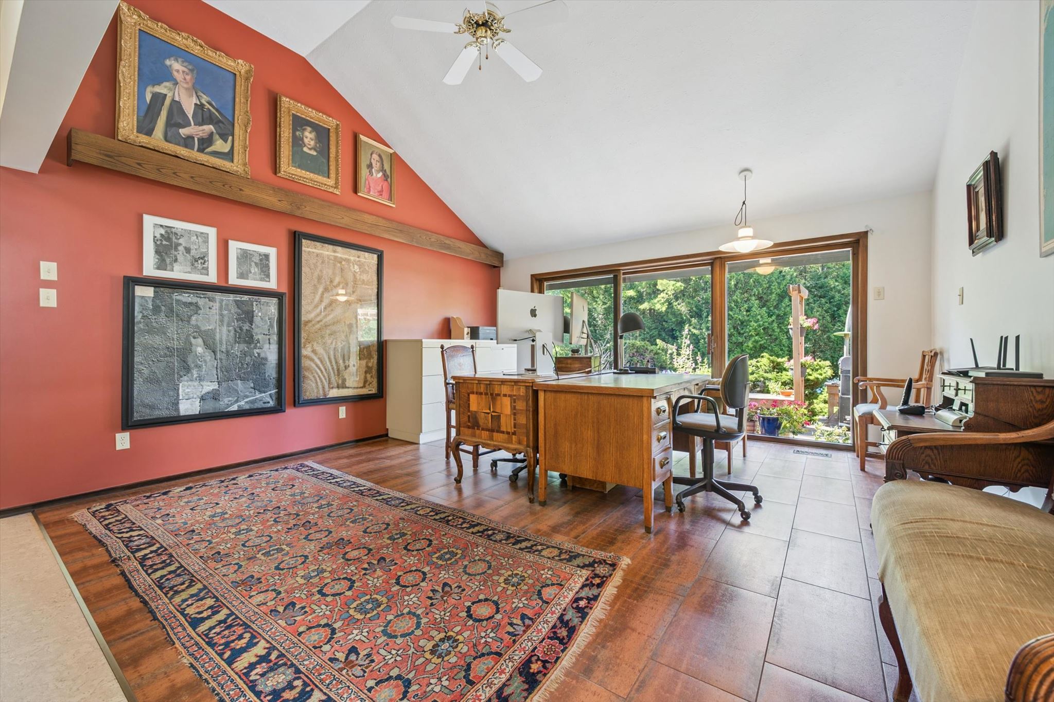 Home office, aerial surveys of the property framed on the wall